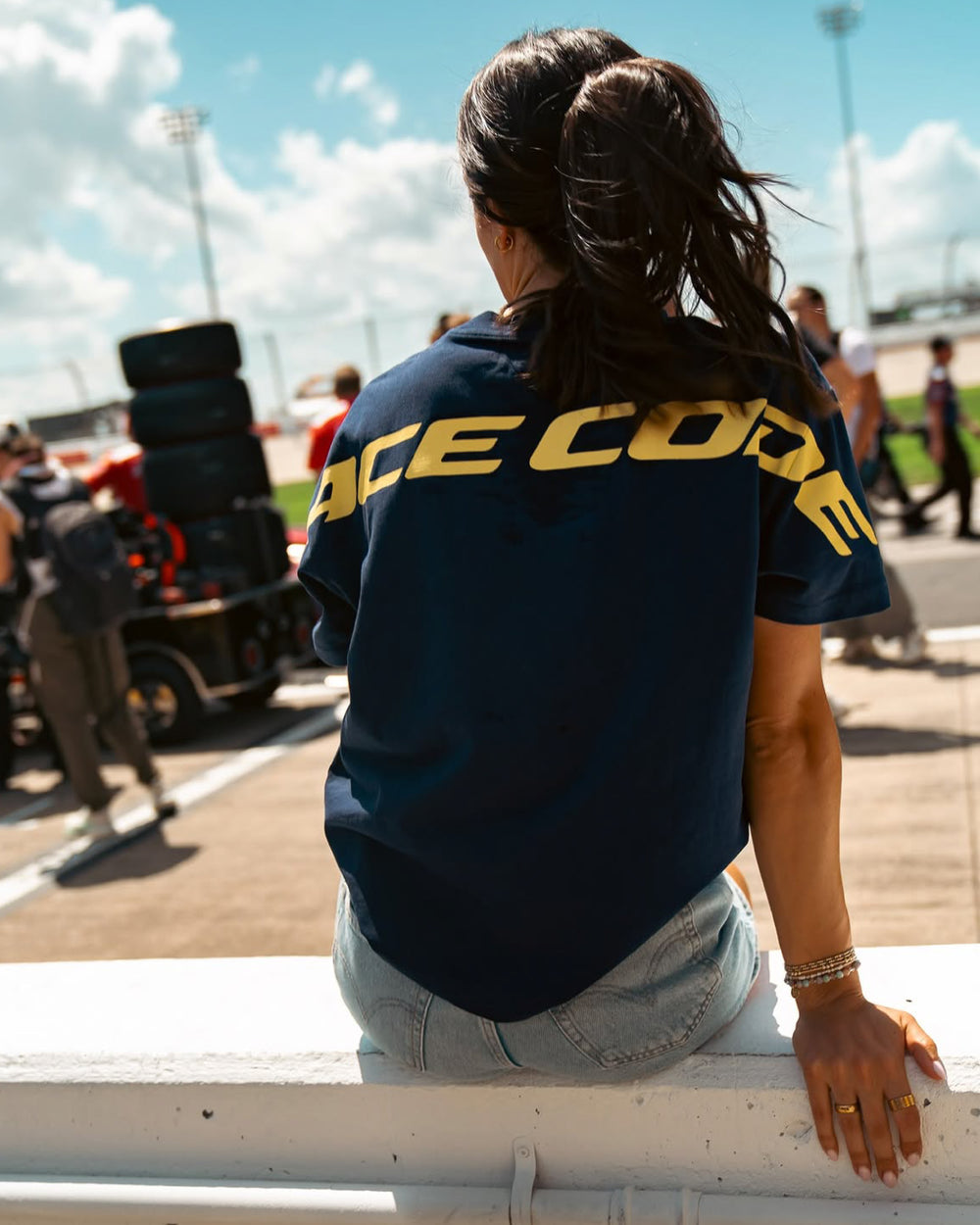 Woman wearing the Circuit Club Navy Tee at a race event