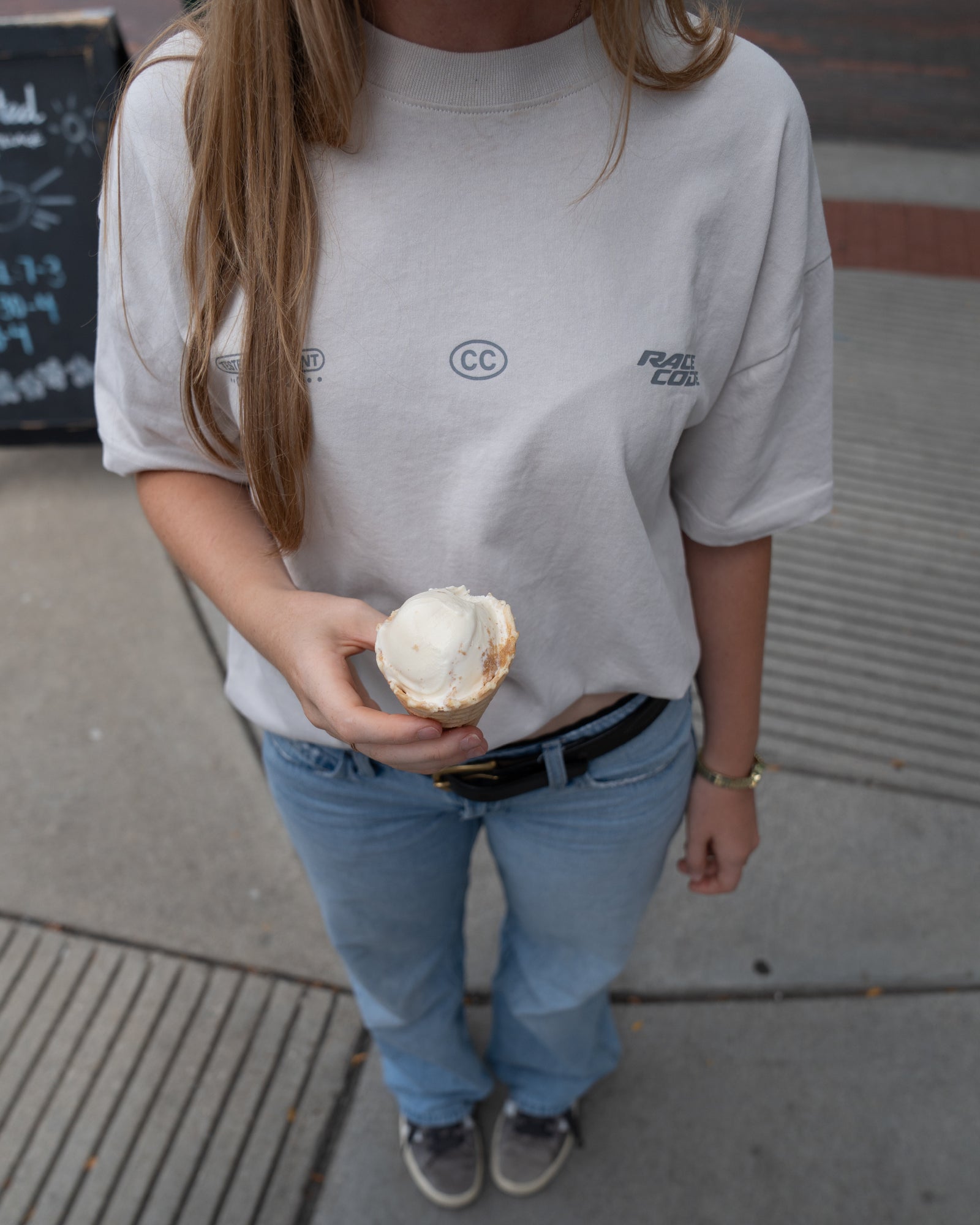 Woman wearing the Circuit Club Gray Tee, back detail