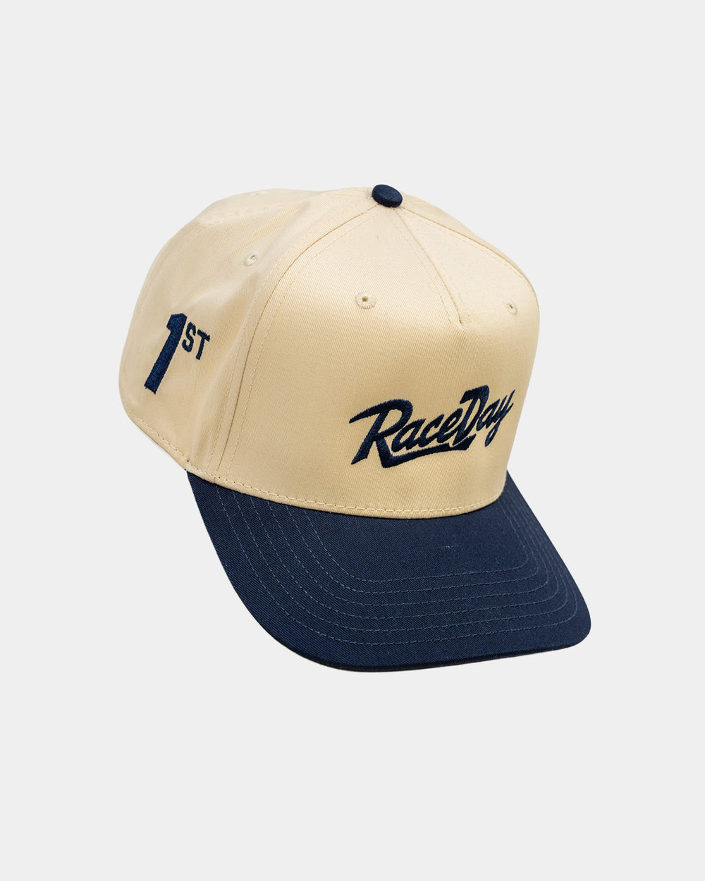 RaceDay Hat Navy angled view showing the RaceDay script and 1st side embroidery