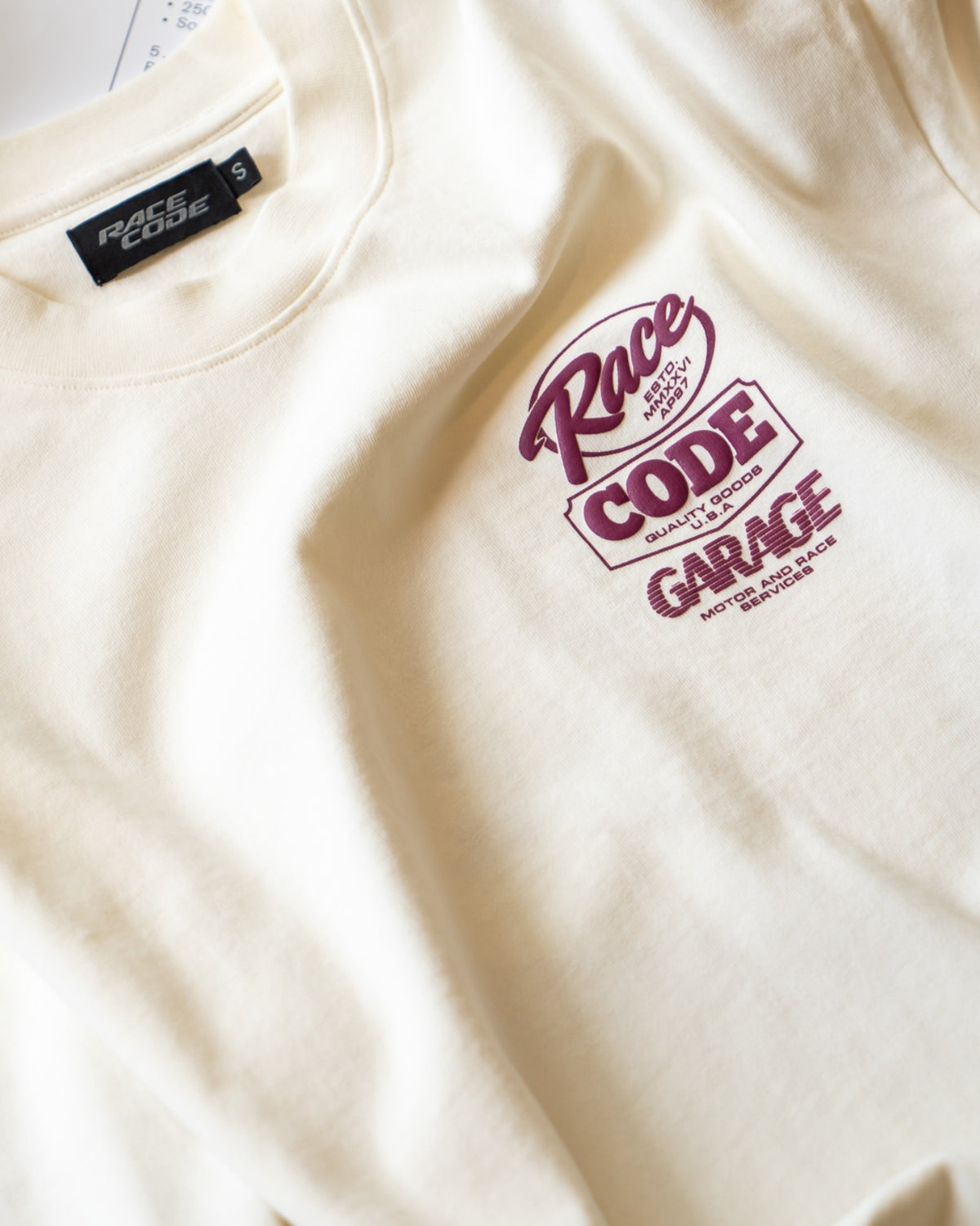 Close-up of the Flame Long Sleeves puff print chest badge