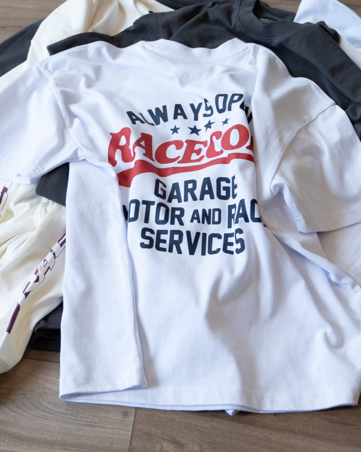 Garage Tee White laid flat, red and navy back print